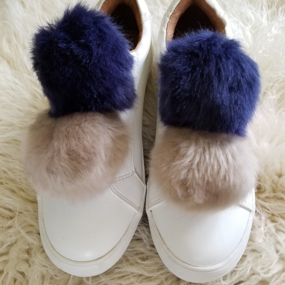 New white shoes with puffy balls